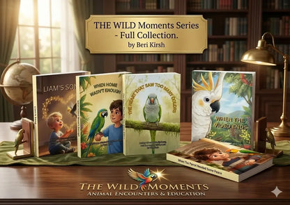 View of The WILD Moments Series - Full Collection: Five children's books on a wooden table between golden parrot bookends.